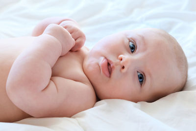 Portrait of a beautiful baby.  newborn baby lying on its side. motherhood. adorable infant.