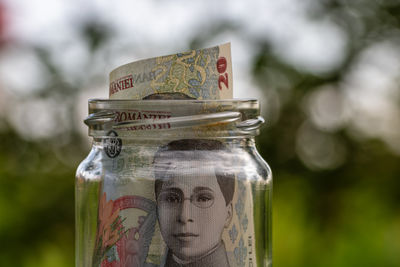 Close-up of coins in jars