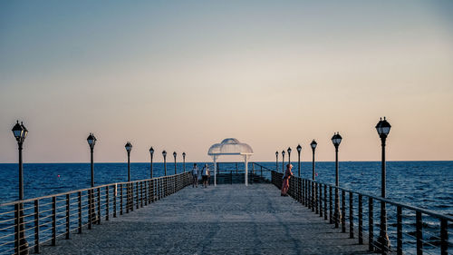 Pier over sea against sky