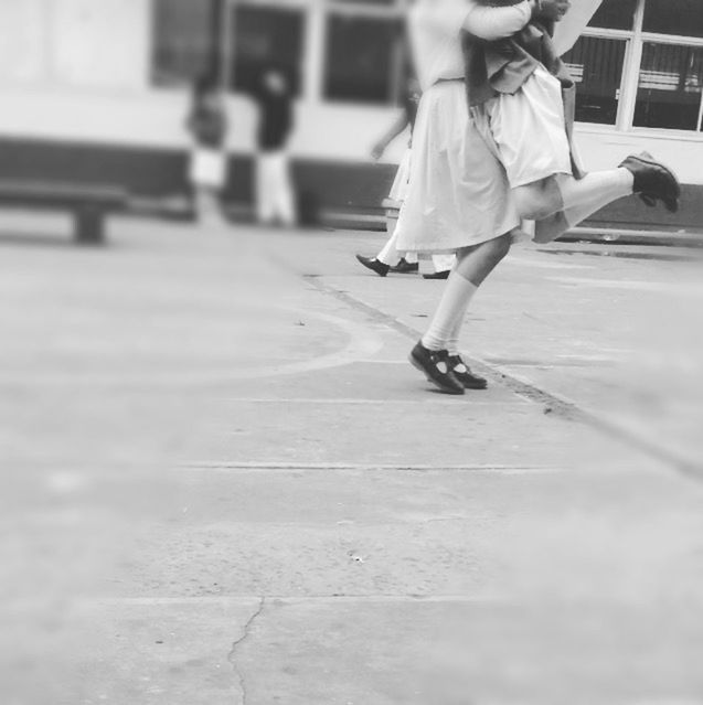 lifestyles, full length, walking, leisure activity, street, on the move, motion, person, men, casual clothing, city life, low section, road, rear view, blurred motion, skateboard, transportation, skateboarding