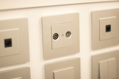 Close-up of telephone booth on wall