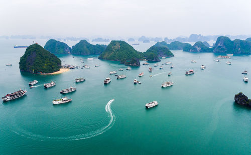 High angle view of boats in sea against sky