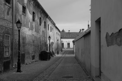 Narrow alley amidst buildings in city