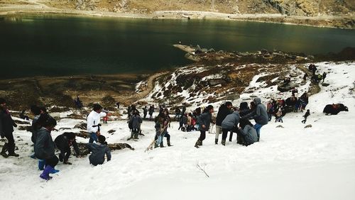 Panoramic view of people in snow