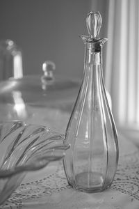 Close-up of glass bottle on table at home