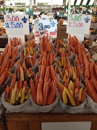 High angle view of carrots in market for sale