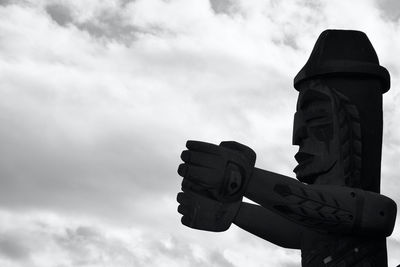 Low angle view of statue against sky