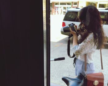 Close-up of woman photographing