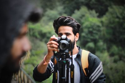 Portrait of man photographing