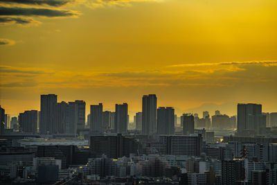 Cityscape against sky during sunset