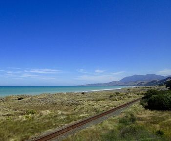 Scenic view of calm sea against blue sky