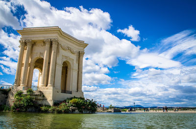 Historical gate by lake at promenade du peyrou park