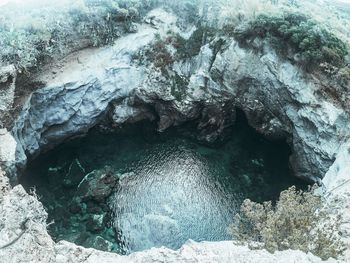 High angle view of rock formation in sea