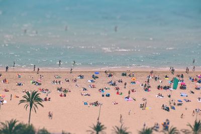 People on beach against sky