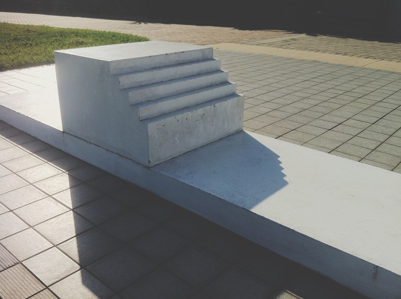 high angle view, shadow, pattern, sunlight, empty, paving stone, tiled floor, footpath, sidewalk, absence, day, outdoors, no people, cobblestone, built structure, walkway, flooring, street, steps, pavement