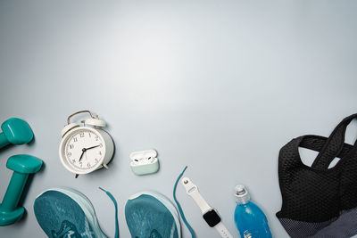 High angle view of clock on table