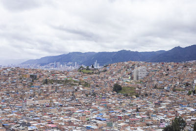 Aerial view of townscape against sky