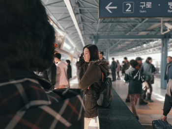 People at railroad station platform