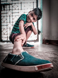 Portrait of smiling boy wearing shoes