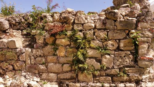 Stone wall against brick wall