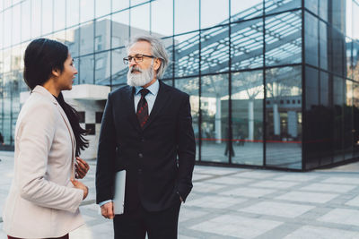 Side view of businessman using mobile phone