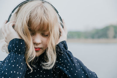 Woman listening to music with headphones