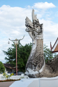 Low angle view of statue against sky