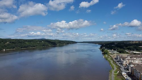 High angle view of river amidst trees against sky