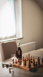 Close-up of chess pieces on table