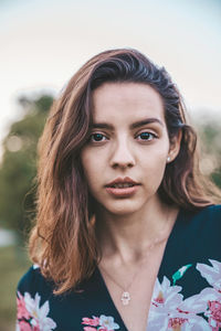 Close-up portrait of woman standing outdoors