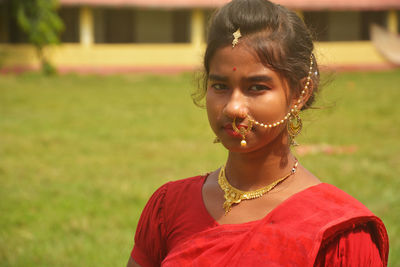 Portrait of smiling girl on field