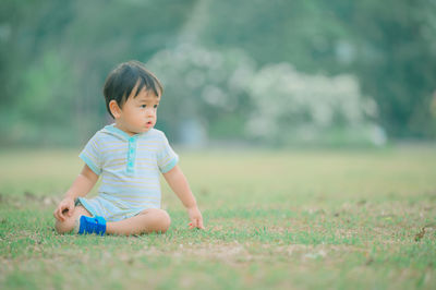 Cute boy playing on field