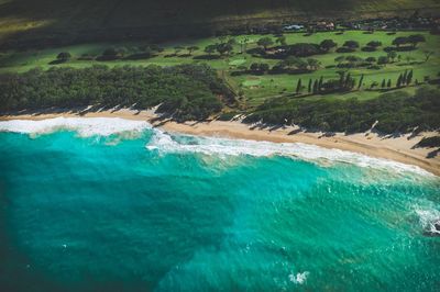 Aerial view of sea and tropical island shore