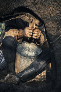 Close-up of man working on wood