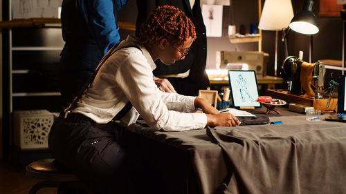 Young woman using laptop at home