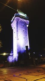 Low angle view of illuminated building at night