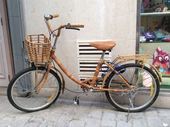 Bicycle parked against wall