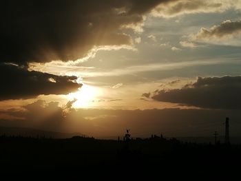 Scenic view of silhouette landscape against sky during sunset