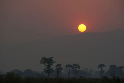 Scenic view of silhouette mountain against sky during sunset