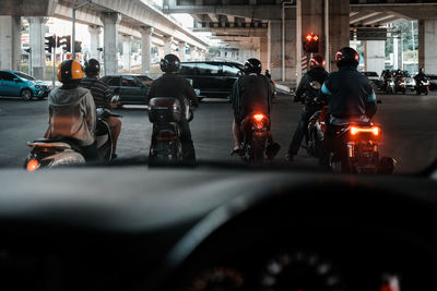 Rush hour motorist in the front row at the traffic light juction