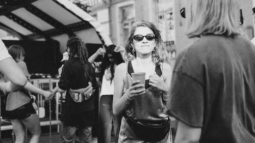 Group of people photographing in city