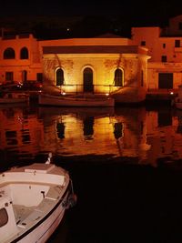 Reflection of illuminated buildings in water