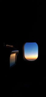 Silhouette of airplane window