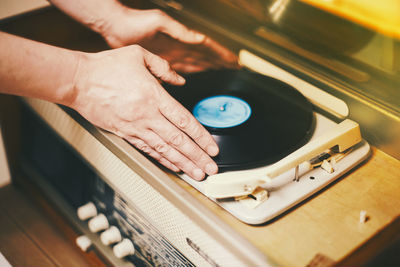 High angle view of man playing turntable