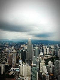 High angle view of modern buildings in city against sky