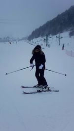 People skiing on snowcapped mountain