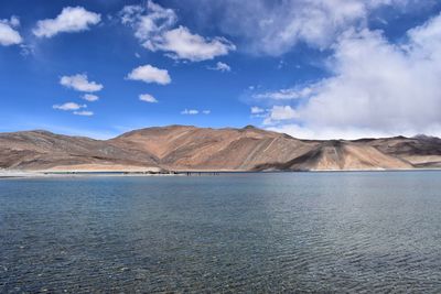 Scenic view of mountain against cloudy sky