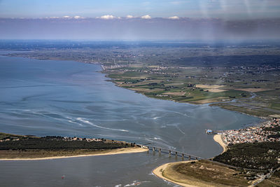 High angle view of road by sea against sky