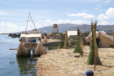 Sailboats on land against sky