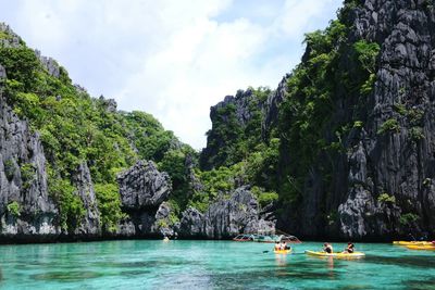 People in boat at sea